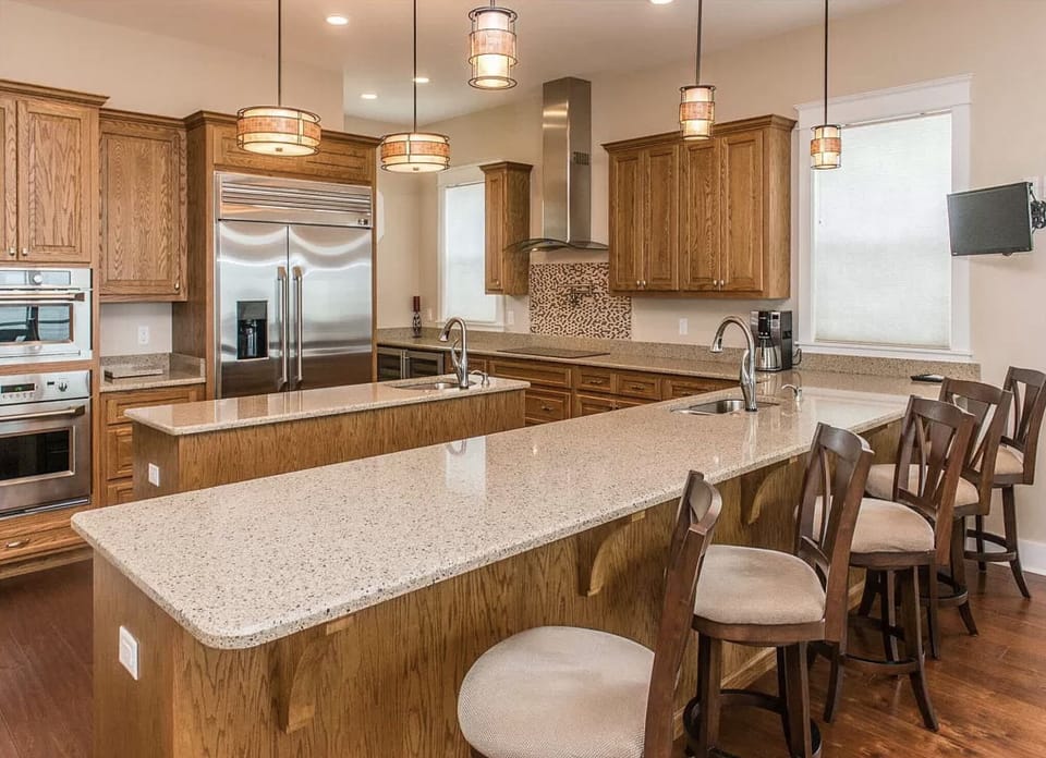 Kitchen located on middle floor with double wine cooler, induction stove, etc