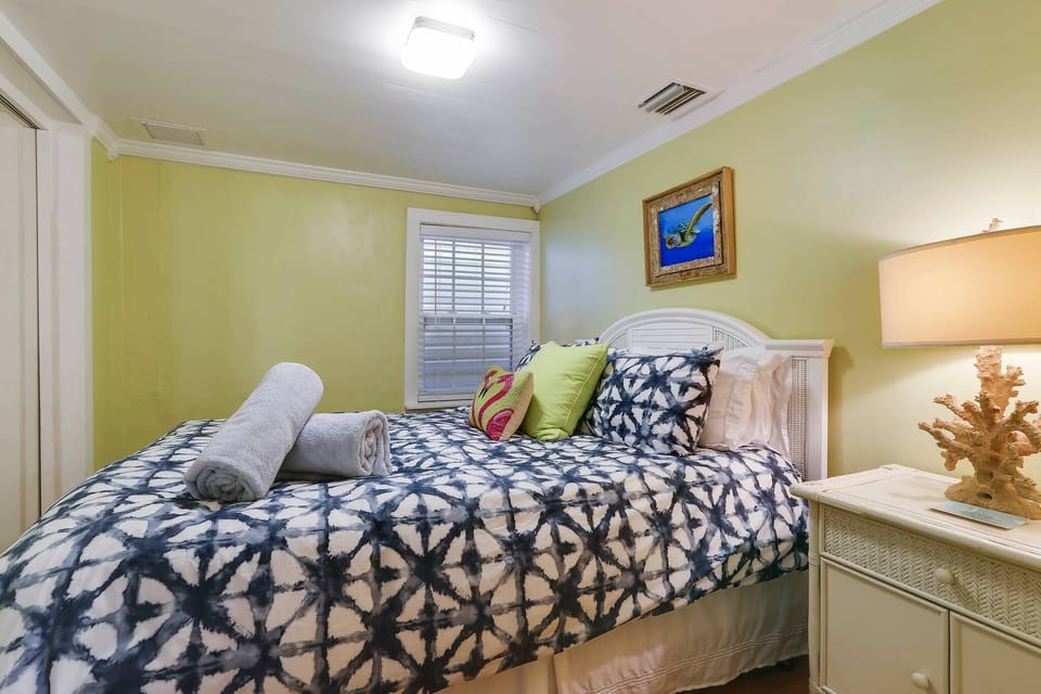 Primary bedroom features a queen bed.