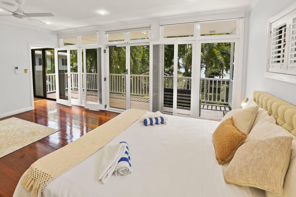 First floor master bedroom with king bed overlooking the foreshore and beach. 
