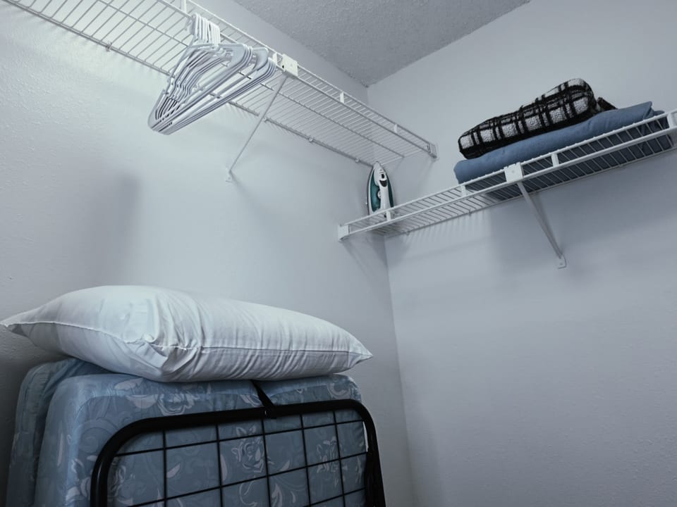 Spacious Walk In Close w/ Twin Size Roll Out Bed