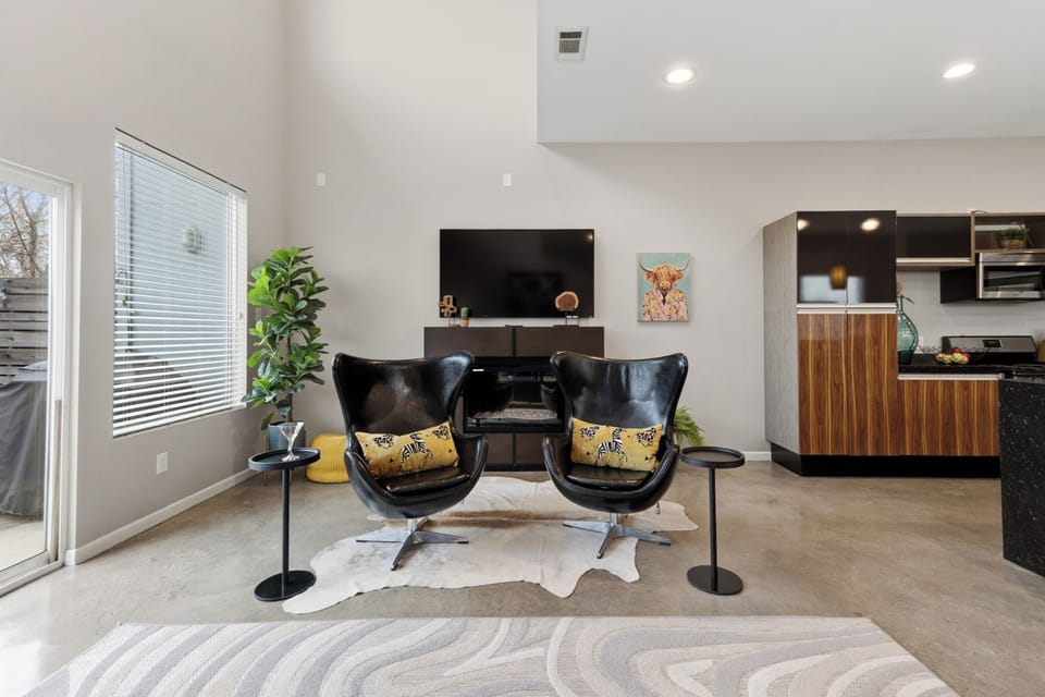 Relax in a pair of comfy egg chairs, perfect for unwinding with a book or your favorite drink.