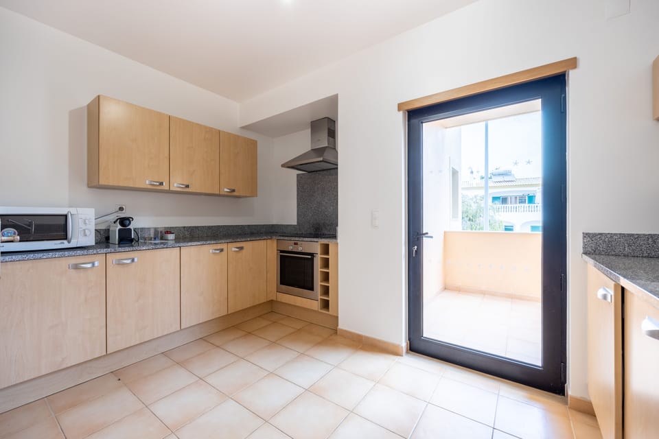 Kitchen area with a small balcony