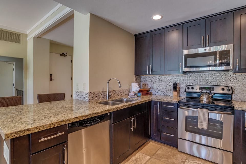   This rich, espresso-toned kitchen isn’t just functional—it’s the heart of your stay, where every meal feels like home  