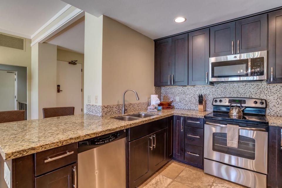   This rich, espresso-toned kitchen isn’t just functional—it’s the heart of your stay, where every meal feels like home  