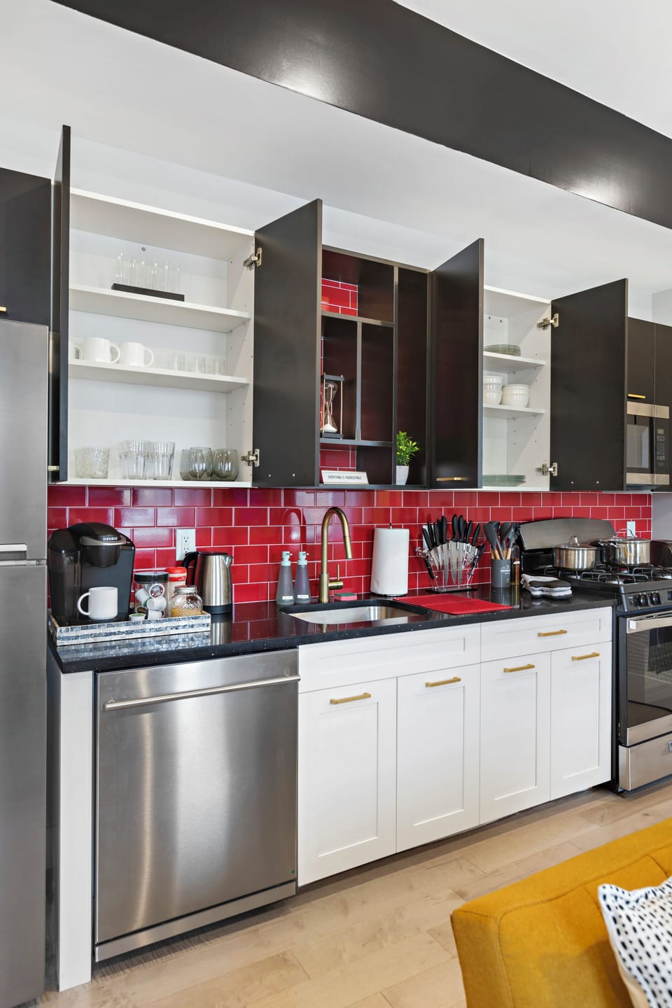 Fully-equipped kitchen with modern stainless steel appliances, ample countertop space, and a wide range of cookware, ensuring a seamless cooking experience for all your culinary needs.
