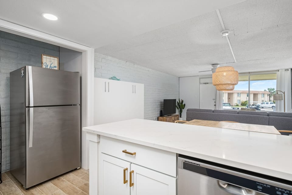 Full sized refrigerators and snack organizer for additional storage.