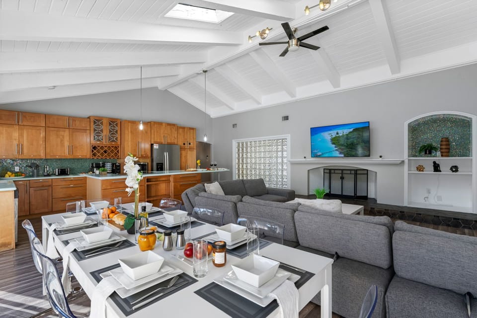 This spacious dining area connects seamlessly to the kitchen and outdoor pool — perfect for entertaining.
