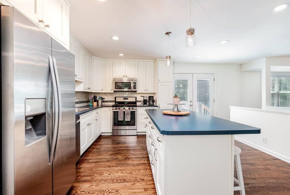 Kitchen with large island, drip coffeemaker, and Keurig
