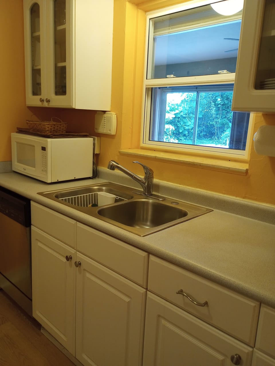 Kitchen view #3 - sink, microwave, dishwasher.