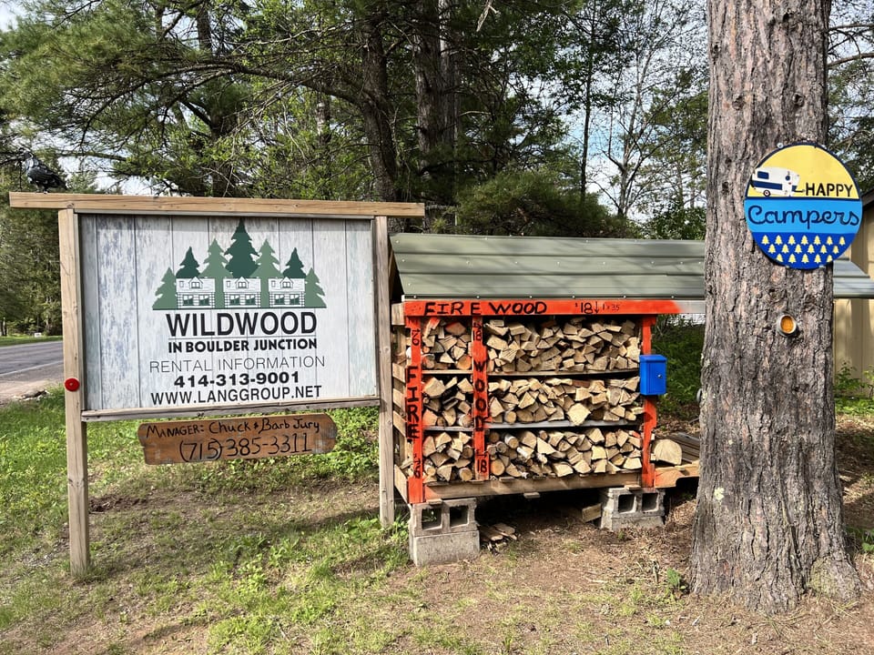 Entrance Sign and fire wood station.