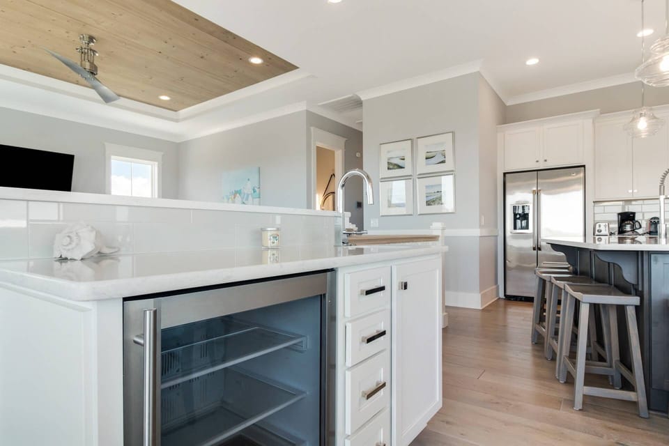 Convenient wet bar with wine cooler available off the kitchen