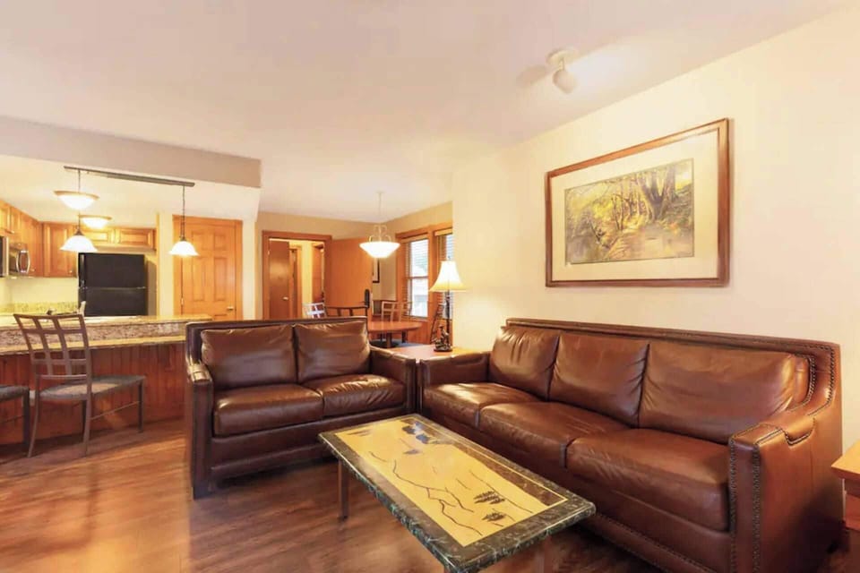 Living room features a queen sleeper sofa for two..