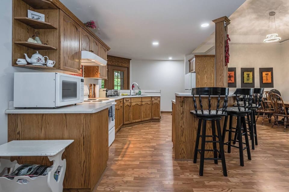 Pull up a chair and enjoy the eat-in kitchen island. The kitchen comes fully stocked with everything you could possibly need to enjoy yourself. 