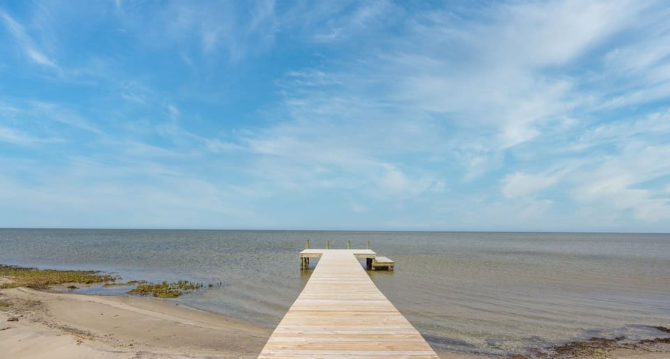 Take a stroll on the private boardwalk to the sound and take in the captivating water views.
