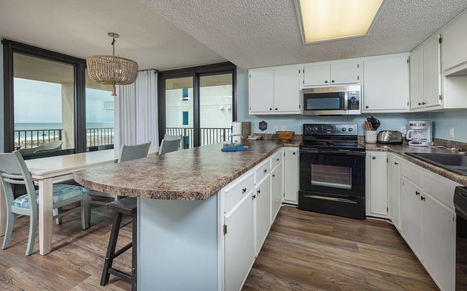Prepare your favorite meals in the kitchen while soaking in the vibrant coastal vibe and stunning views