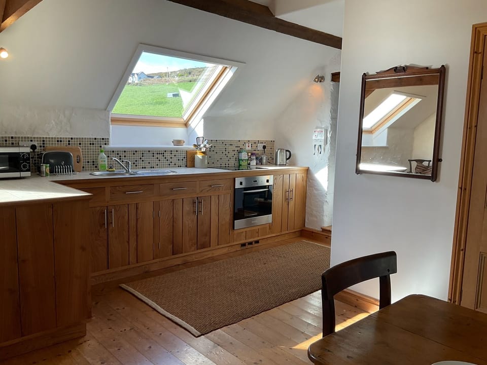 fully equipped kitchen with hob, oven fridge/freezer, microwave, toaster, kettle