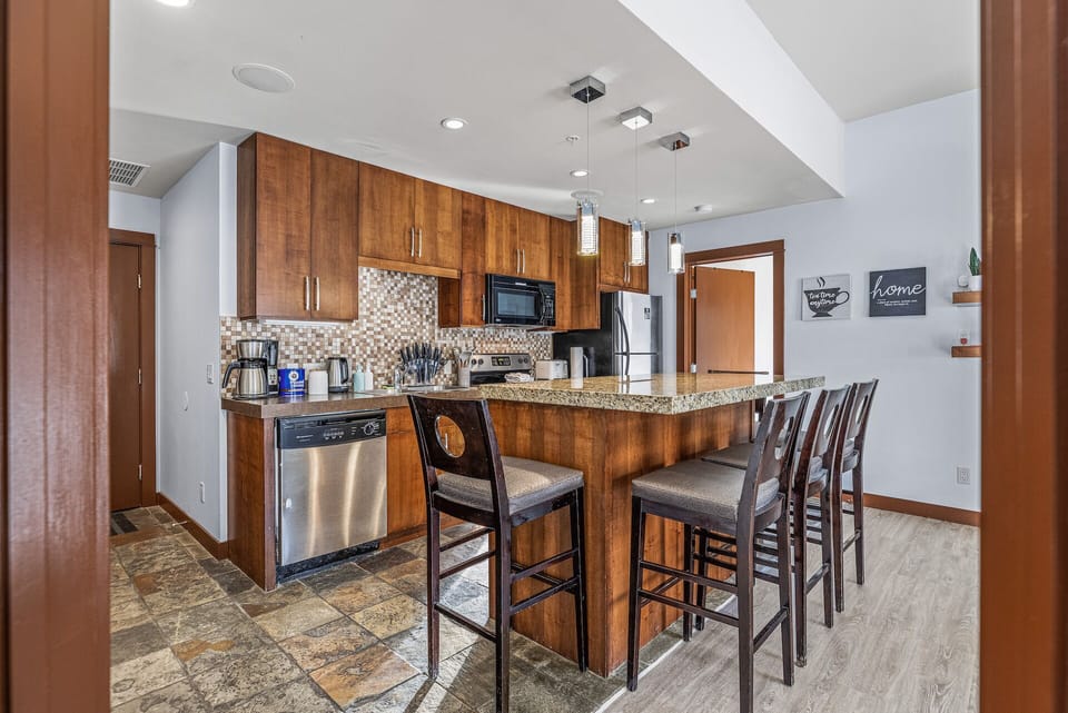 Fully equipped kitchen with basic appliances and blender. 