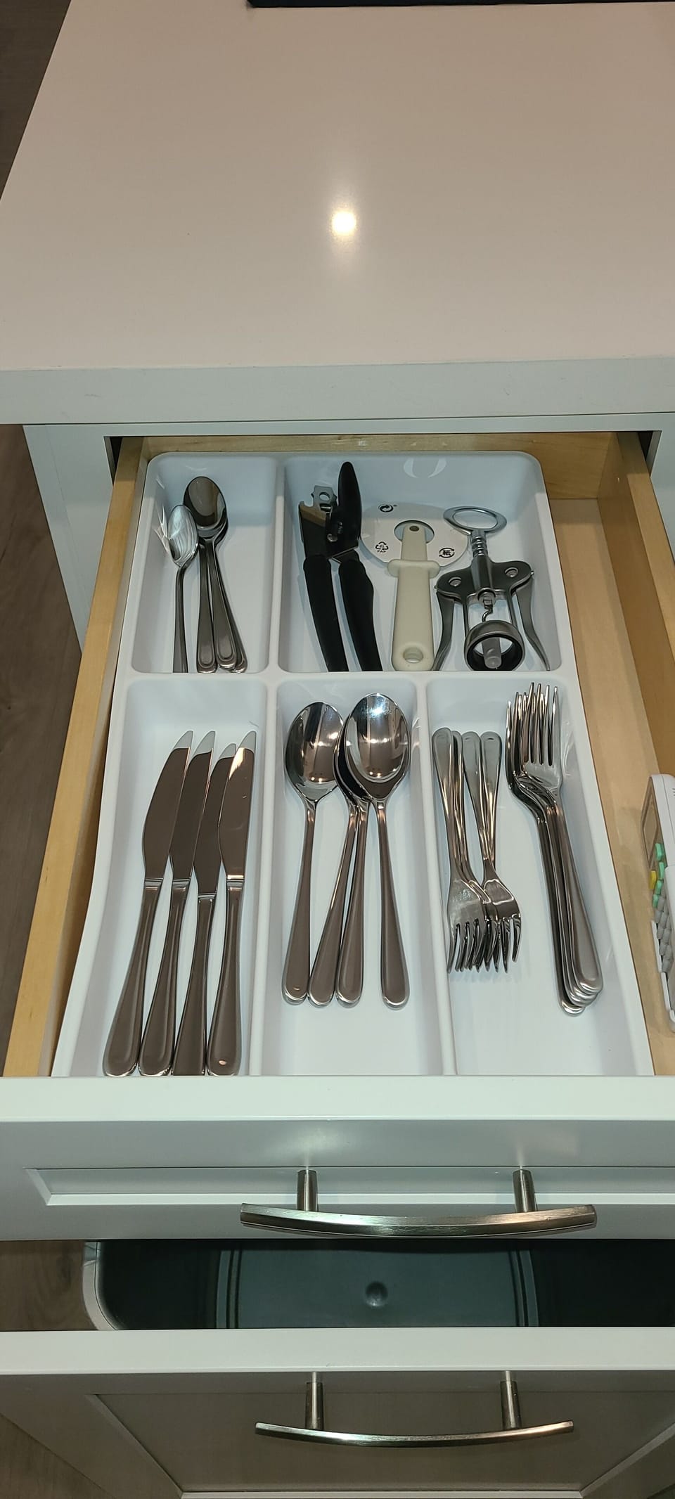 Full place settings and utensils for 4 people, also coffee mugs, and soup bowls.