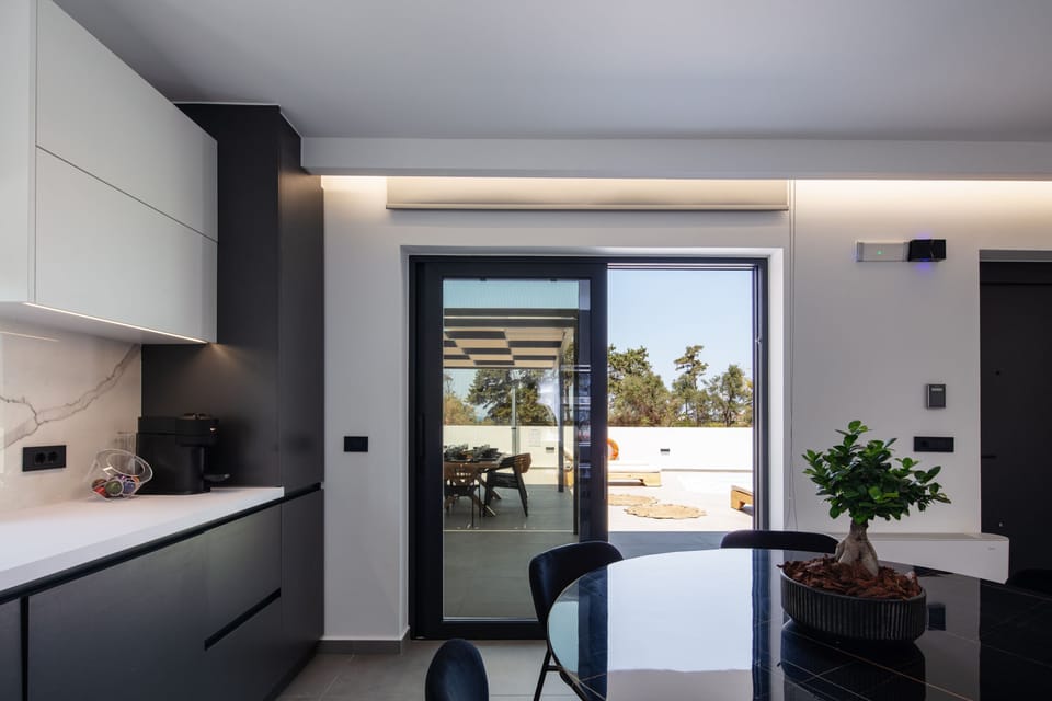 Featuring direct outdoor access to the BBQ area and pool.