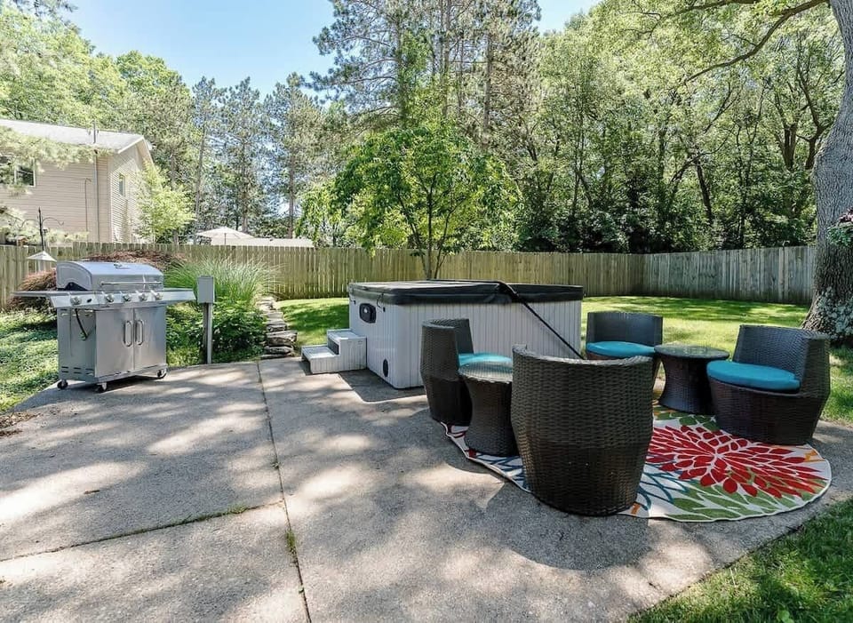 Hot Tub & Sitting area in backyard