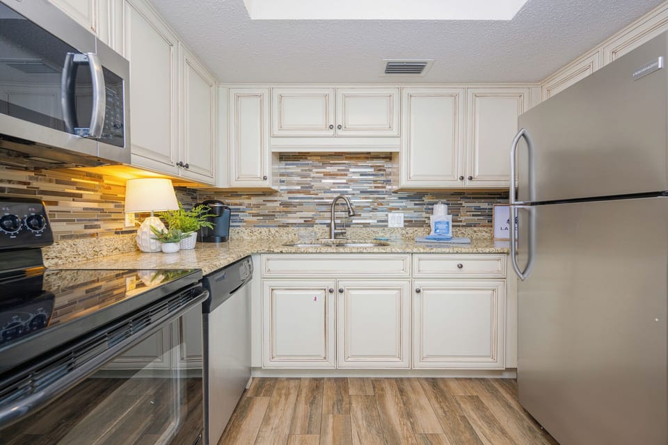 Create delicious meals while enjoying the sleek design and vibrant colors of your inviting kitchen space