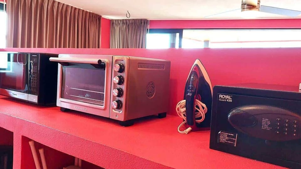Personal safe, iron/board, toaster oven and microwave.