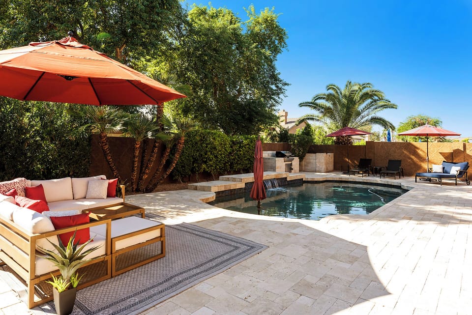 pacious resort-style w/heated pool, waterfall feature, lounge seating, 