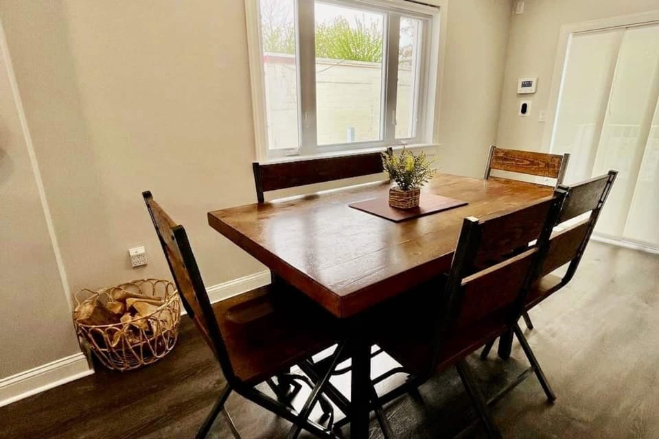 Dinner Table and sliding patio door that leads to deck and patio. 