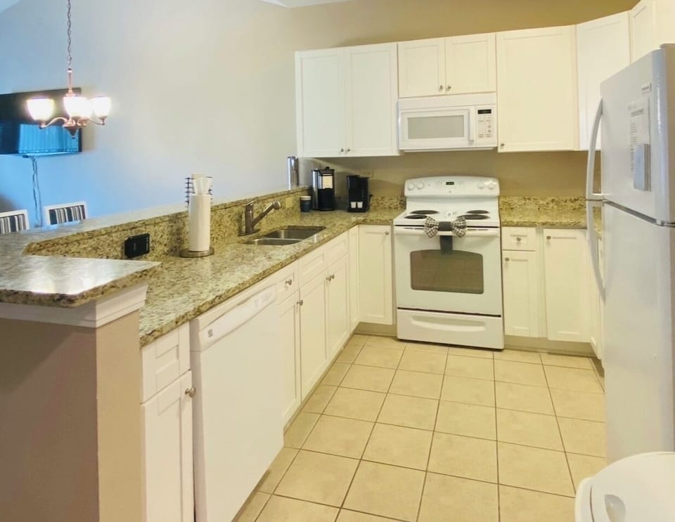 Full  service kitchen adjoining living space.  This is an open floor plan.
