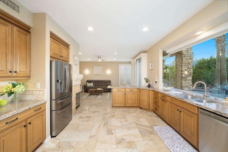 Updated appliances, including refrigerator, beverage fridge and dishwasher