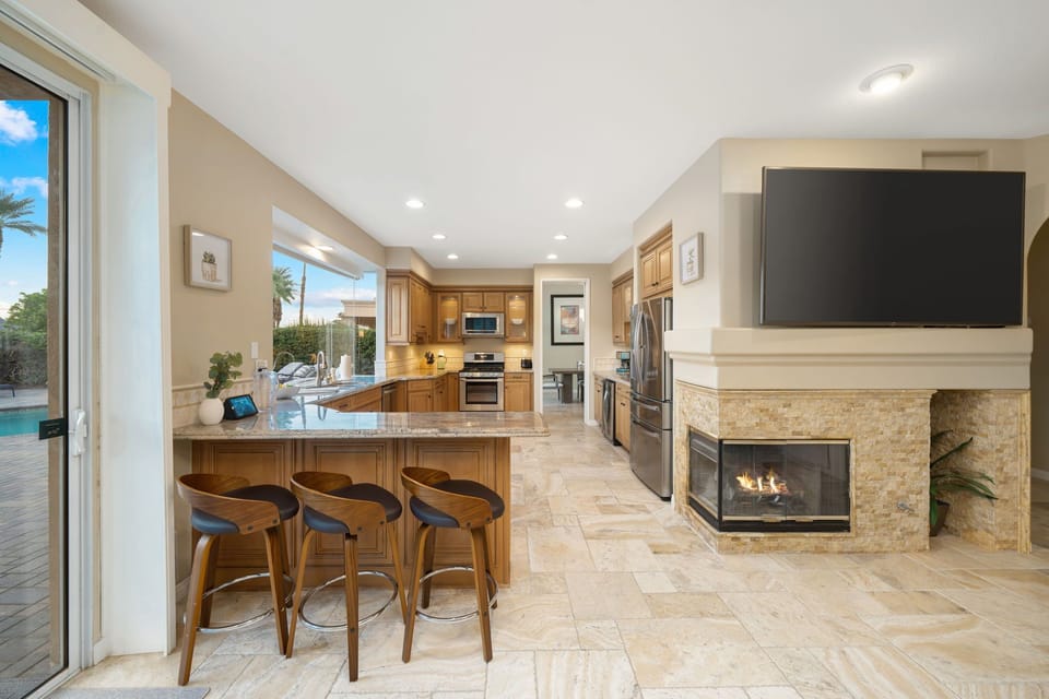 Kitchen bar opens to living room