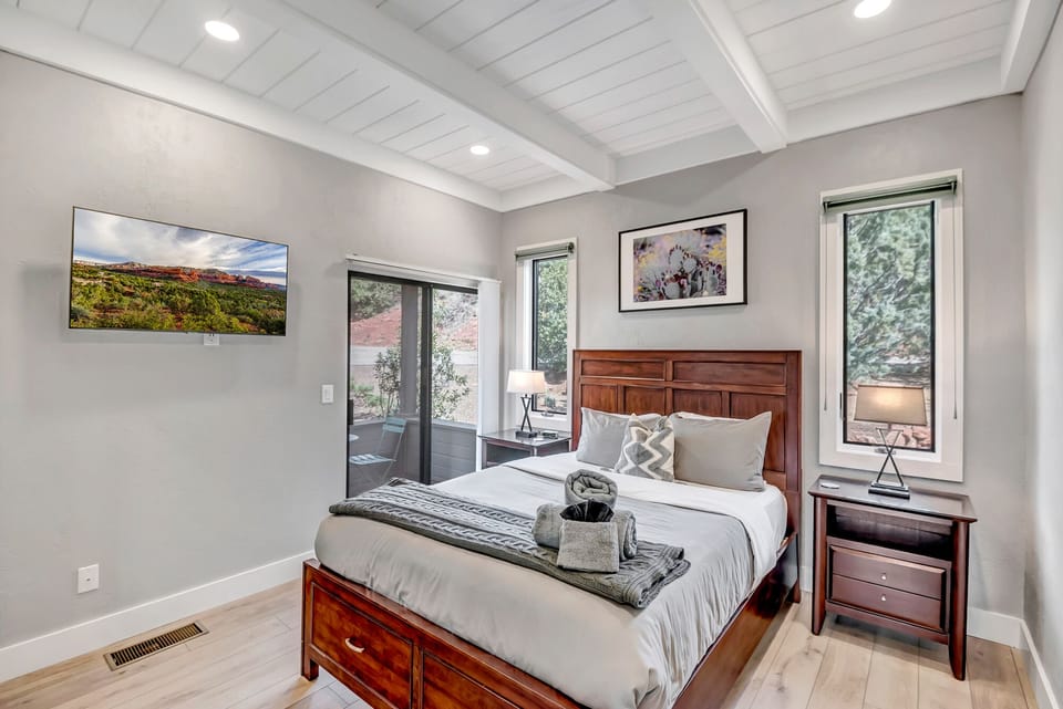 Bedroom Three with Queen Bed, 45" Smart TV and Private Balcony Access