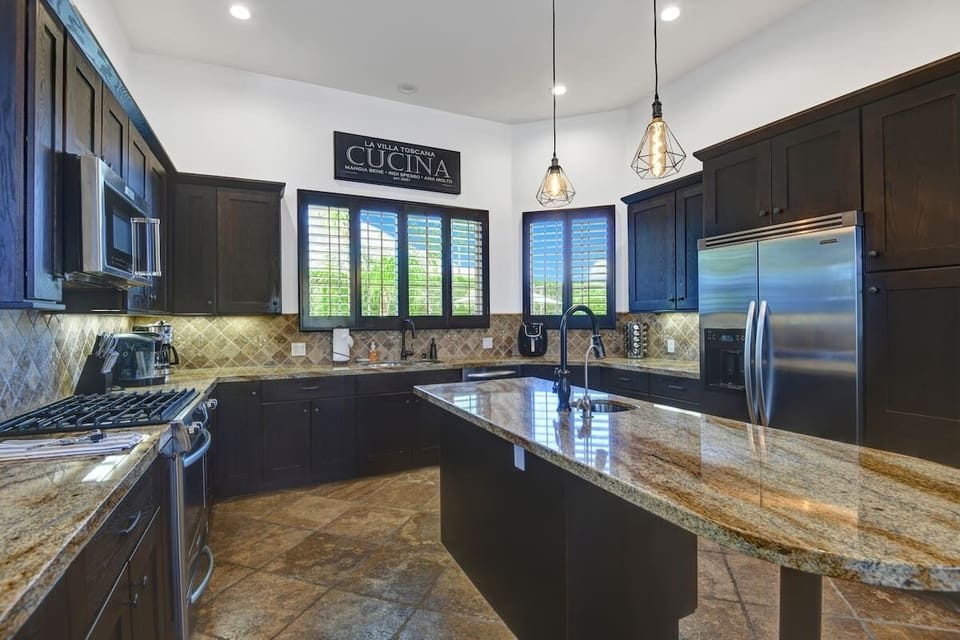 Large fridge and gas stove.