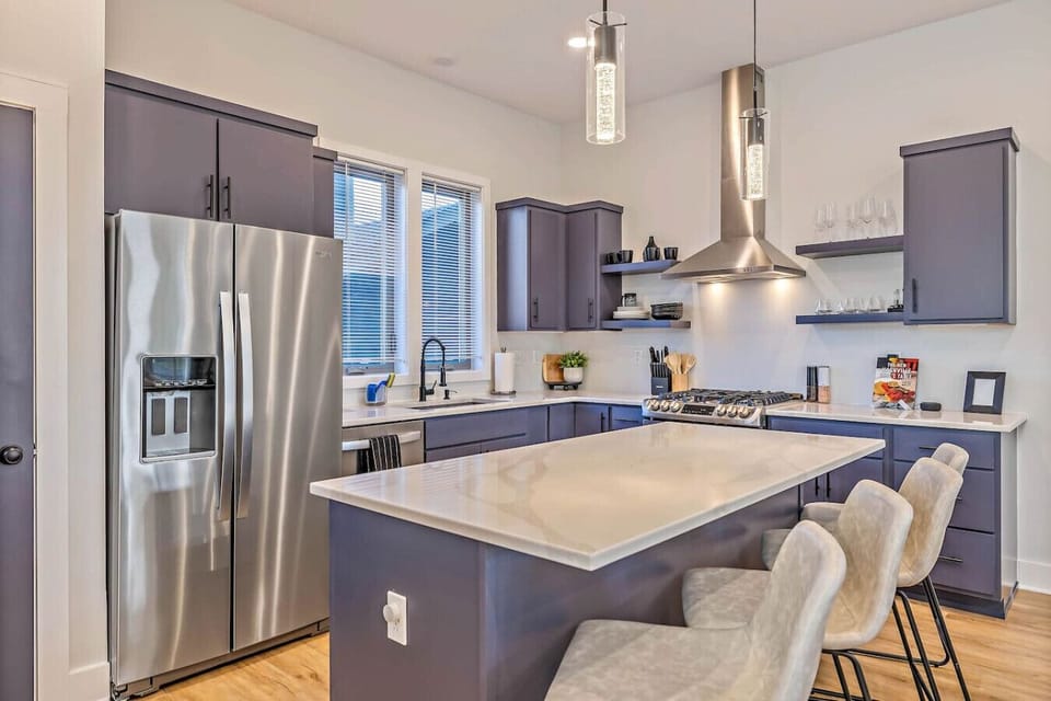 Fully equipped kitchen with dishware and dining seating for 12