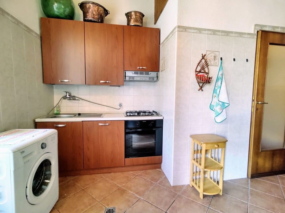 Laundry Room, Cabinetry, Furniture, Property, Building, Countertop, Clothes Dryer, Washing Machine, Kitchen Appliance, Wood
