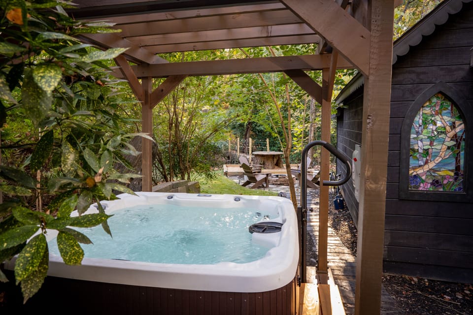 Our four person hot tub under the lighted pergola is perfect for relaxation.