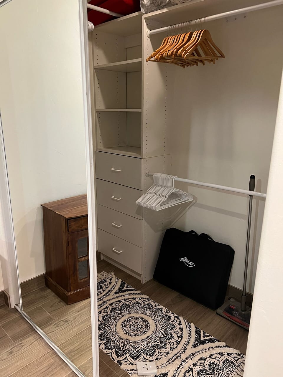 One side of the lighted bedroom closet space 