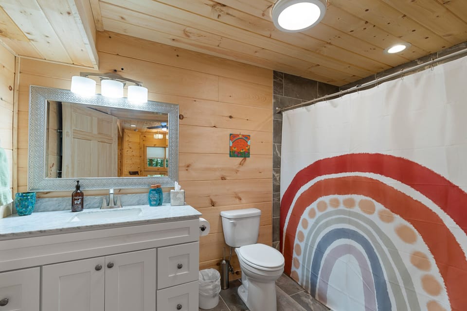 Massive tile shower behind the rainbow shower curtain! 🌈❤️💦💧