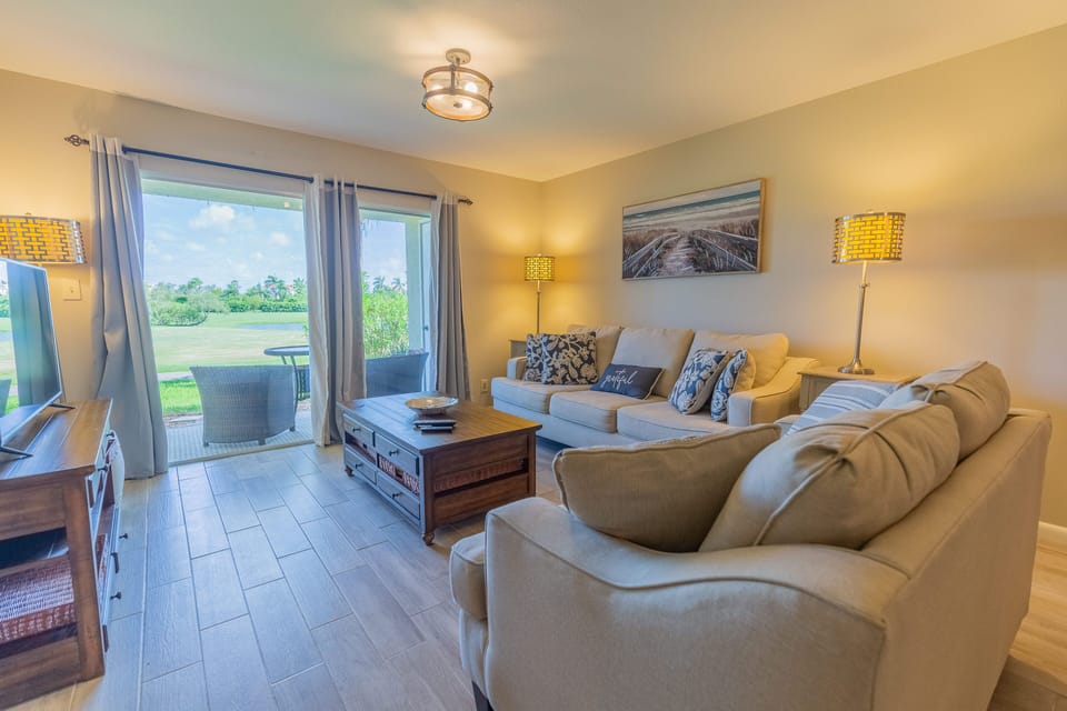 Spacious living room , view of golf course . 