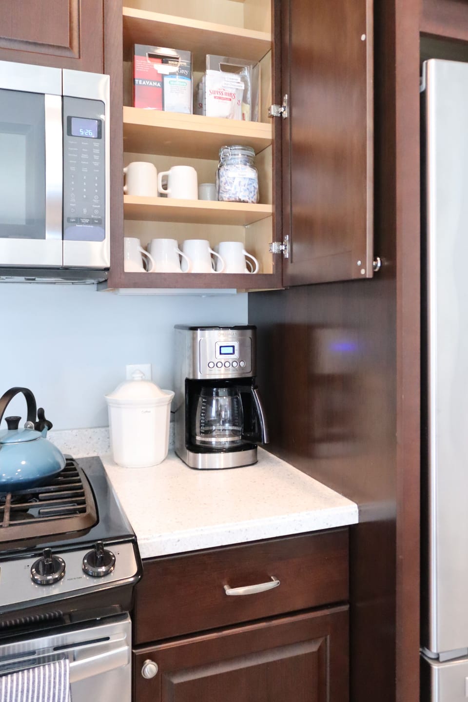 Our beverage station is stocked with coffee, hot cocoa, tea, cream, and sugar 