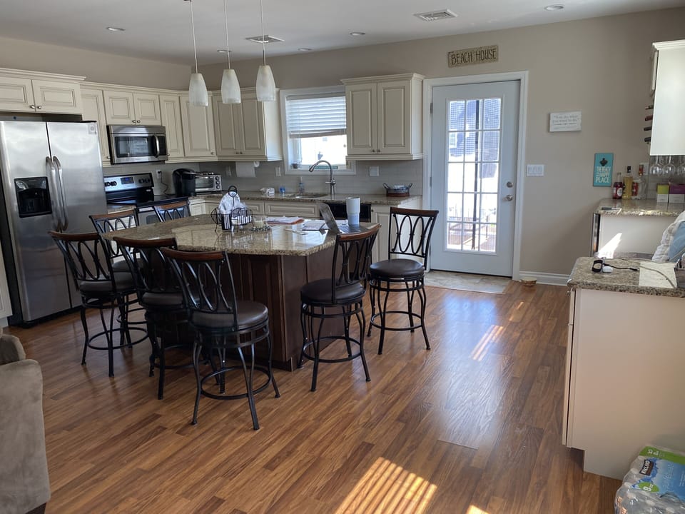 Kitchen and Dining area.  Window seat and beverage refrigerator on the right. 