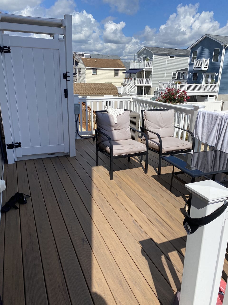 Deck, and outdoor shower off the kitchen. 
 Stairs to the backyard. 
