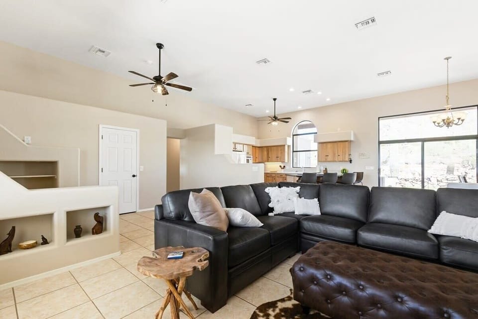 Living room with the kitchen in the background.