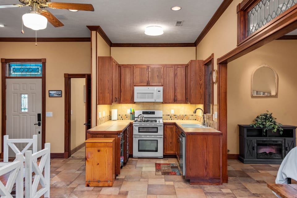 Efficient kitchen with gas oven/range and microwave. 