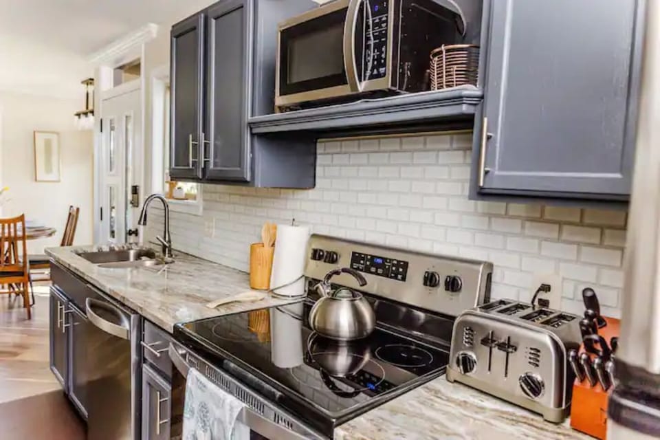 Green pan cookware, Henckels knives, and Cuisinart appliances.