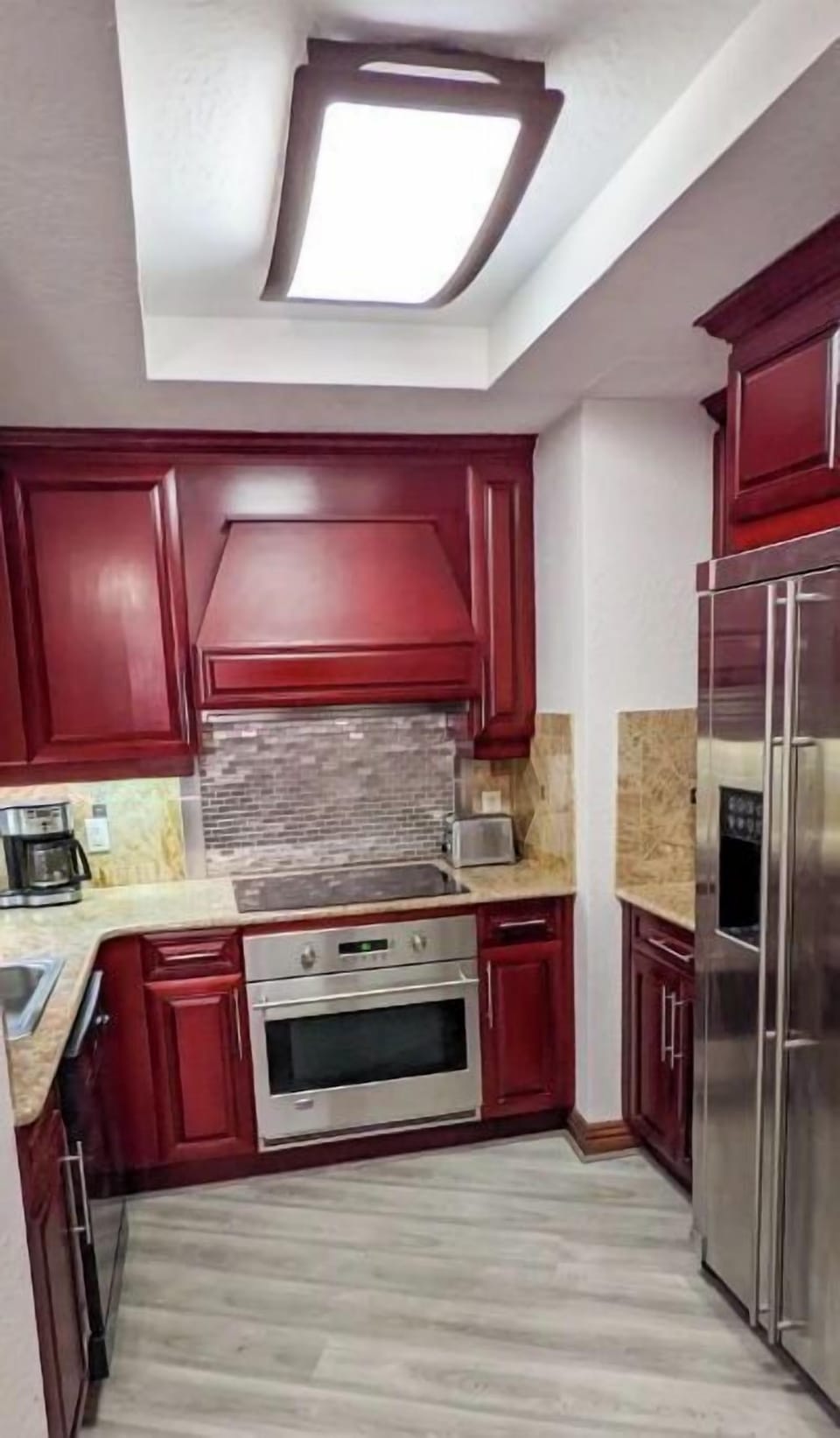 Full sized kitchen with refrigerator, oven, 4 burner stove, microwave, and washe