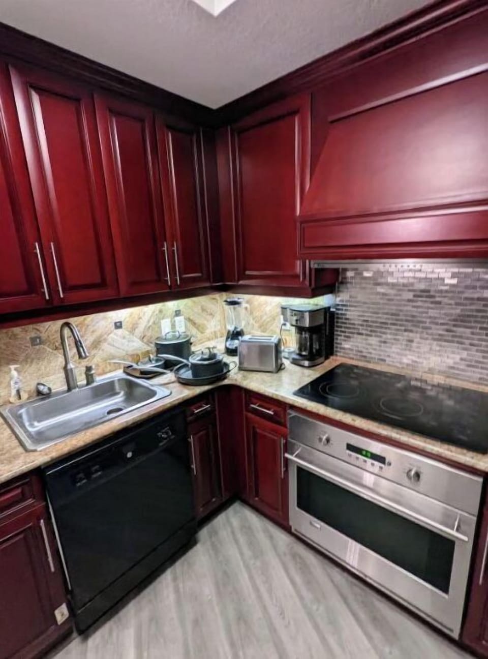Full sized kitchen with pots/pans, cutlery, toaster, coffee maker, blender

