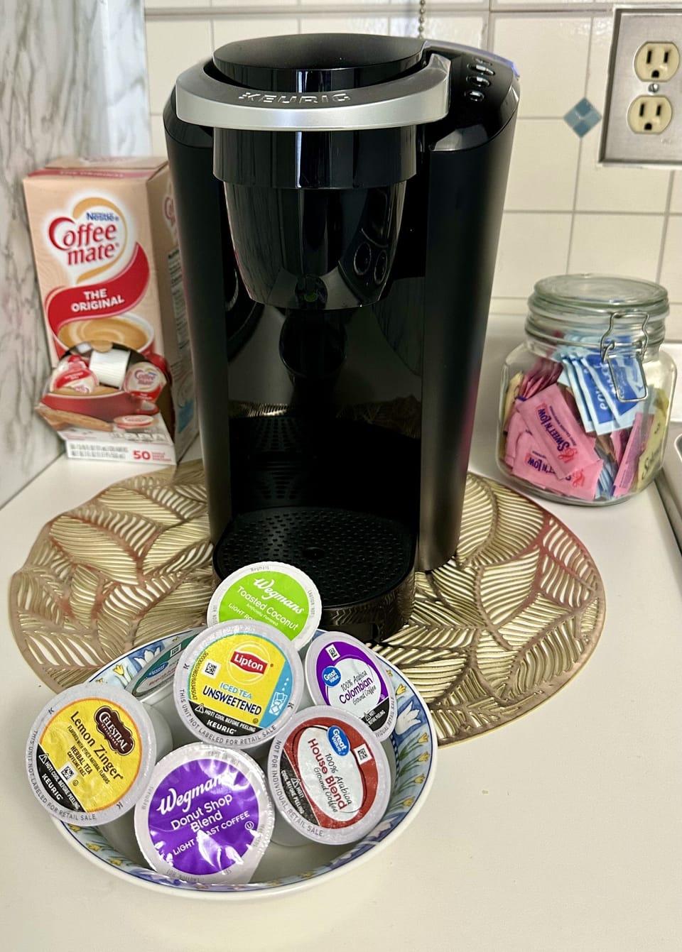 Coffee bar with complimentary K-cups, sweetener and creamer