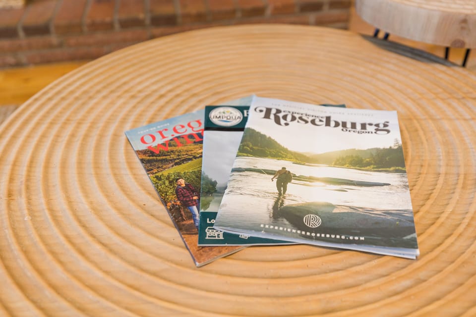 Various local maps, magazines, and guides can be found in the living room area.
