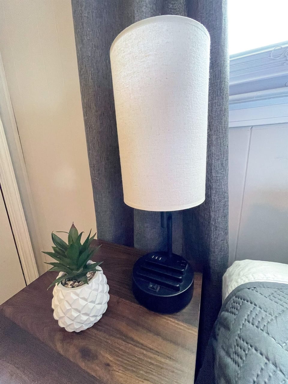All bedside tables feature a lamp with 3 USB charging ports, an AC power outlet, and a phone stand